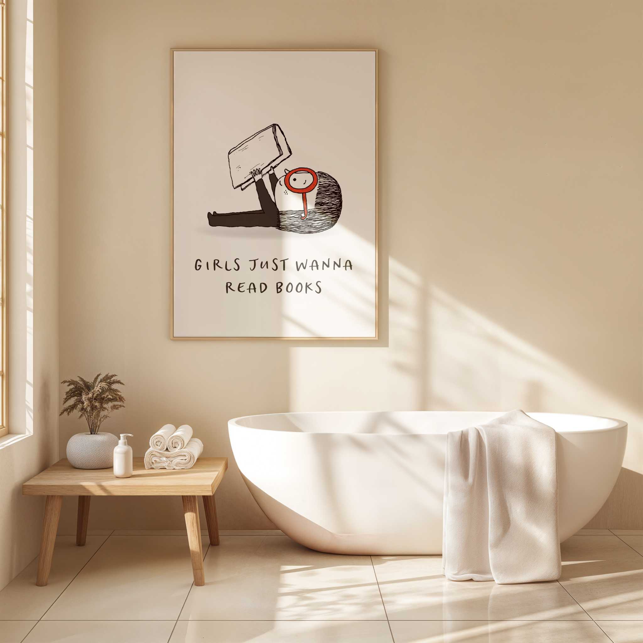 Bathroom interior with a bathtub, plant, and framed artwork on the wall with text 'Girls Just Wanna Read Books'