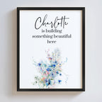 Framed print with floral design and text on a white background