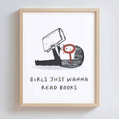 Framed artwork with a black and white illustration of a girl with large red glasses, holding a book, with text 'Girls just wanna read books' on a white background.