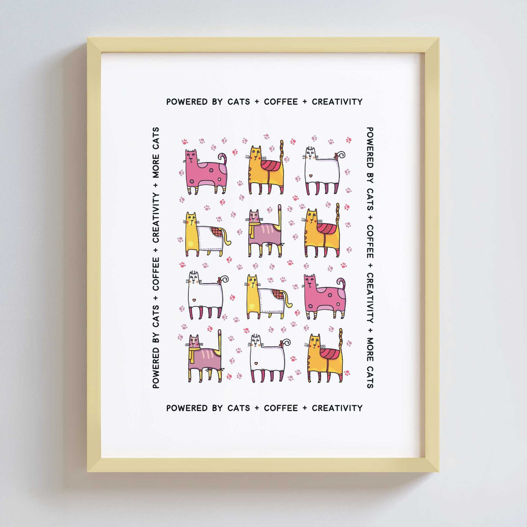Framed print with colorful cat illustrations and text on a white background