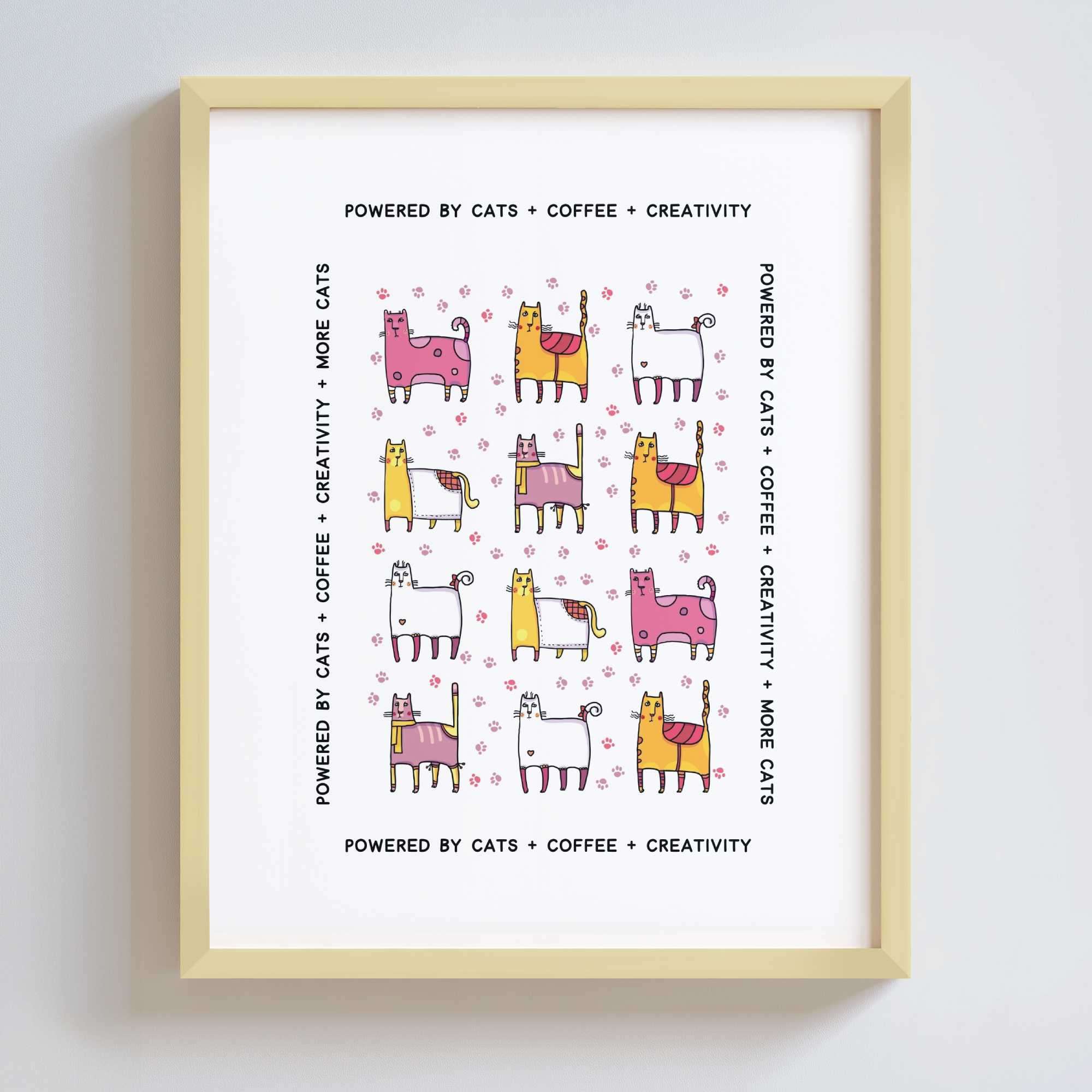 Framed print with colorful cat illustrations and text on a white background