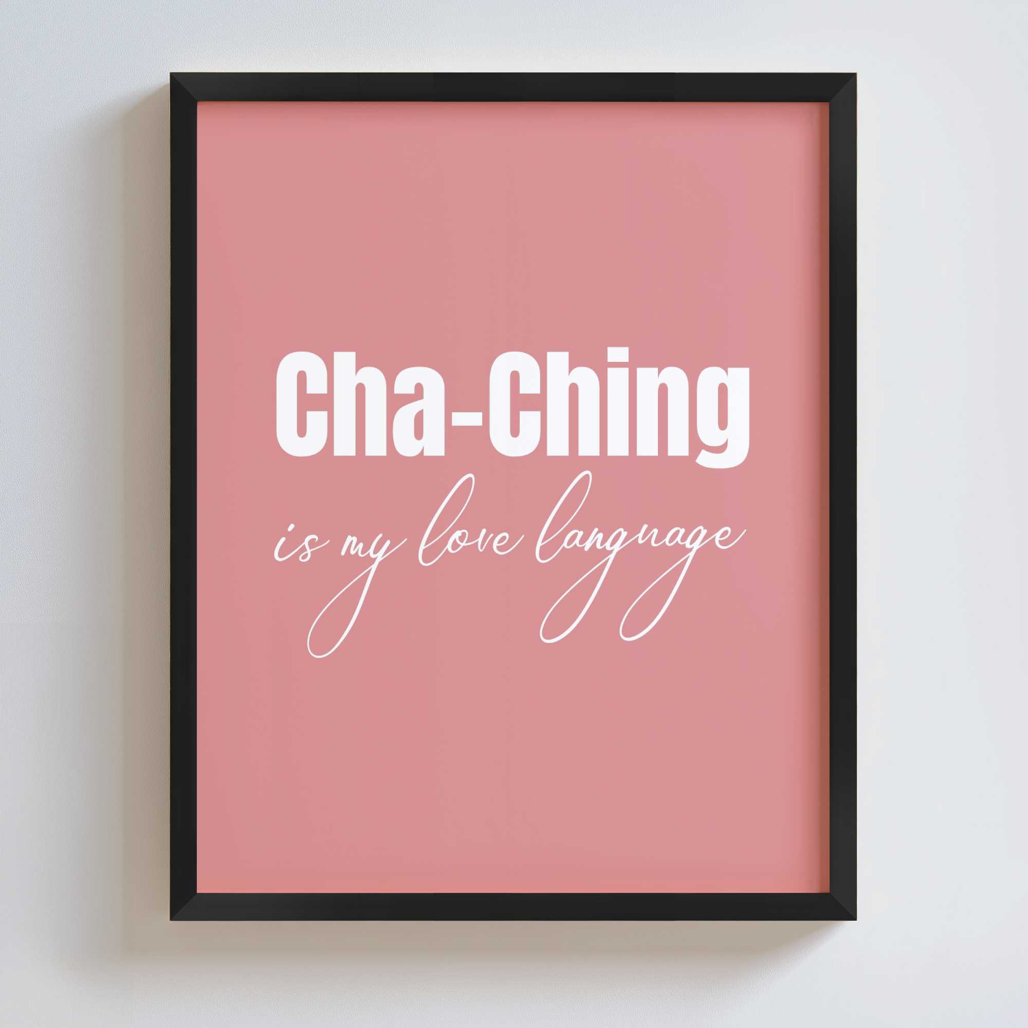 Framed pink poster with 'Cha-Ching is my love language' text in a black frame on a white wall.