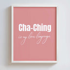 Framed pink poster with 'Cha-Ching is my love language' text on a white background
