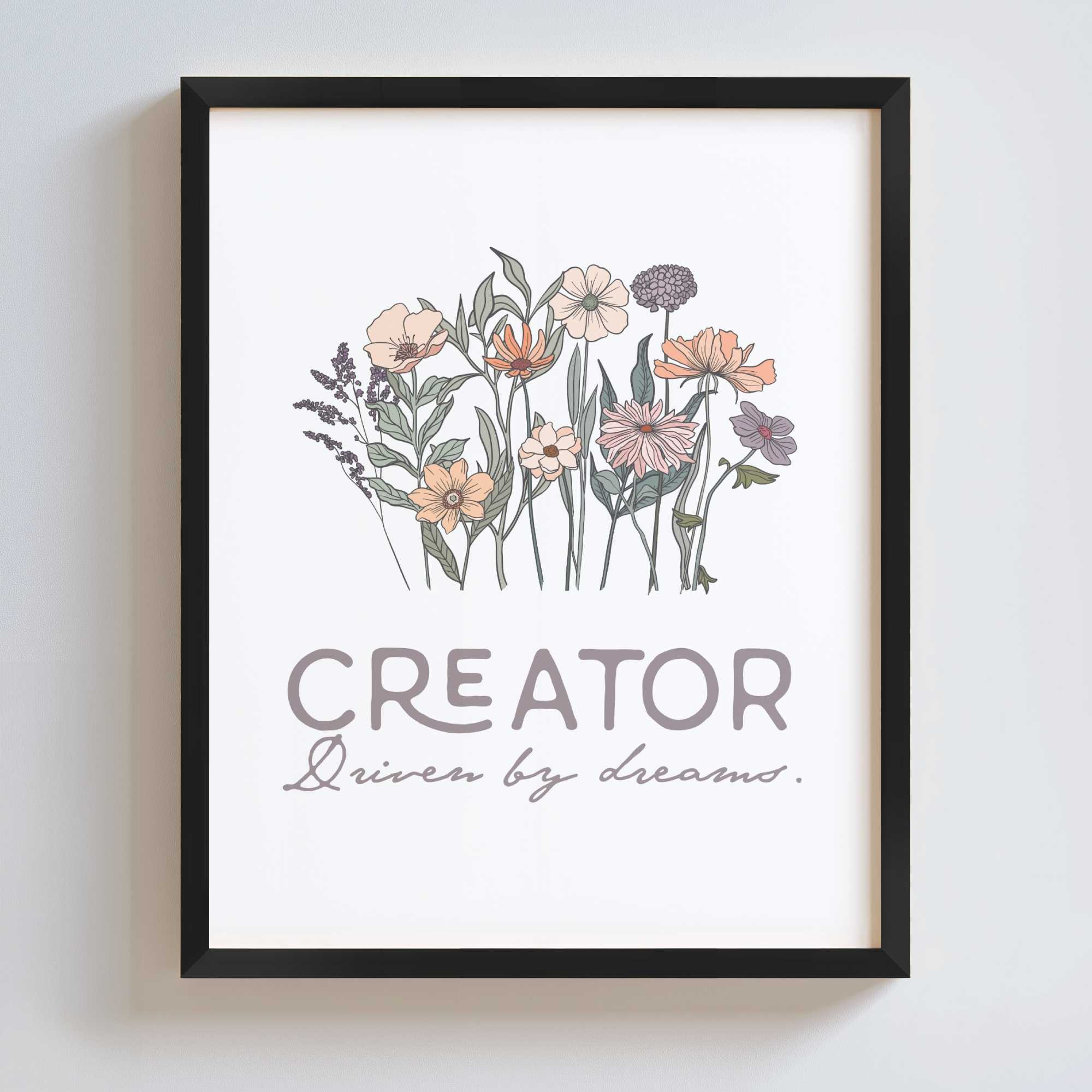 Framed artwork with floral design and text 'CREATOR Driven by dreams.' on a white background