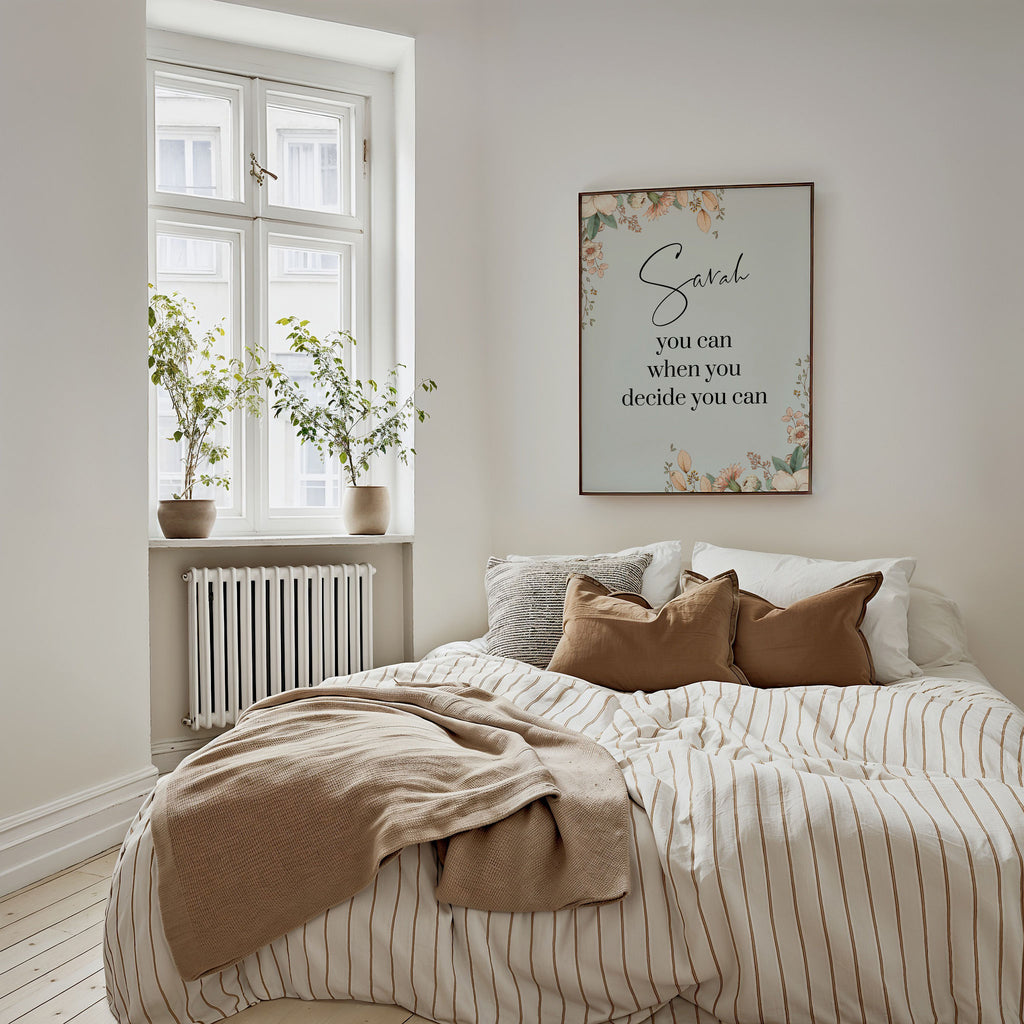 Botanical custom name wall art hung on a bedroom wall. A floral print in a soft palette.