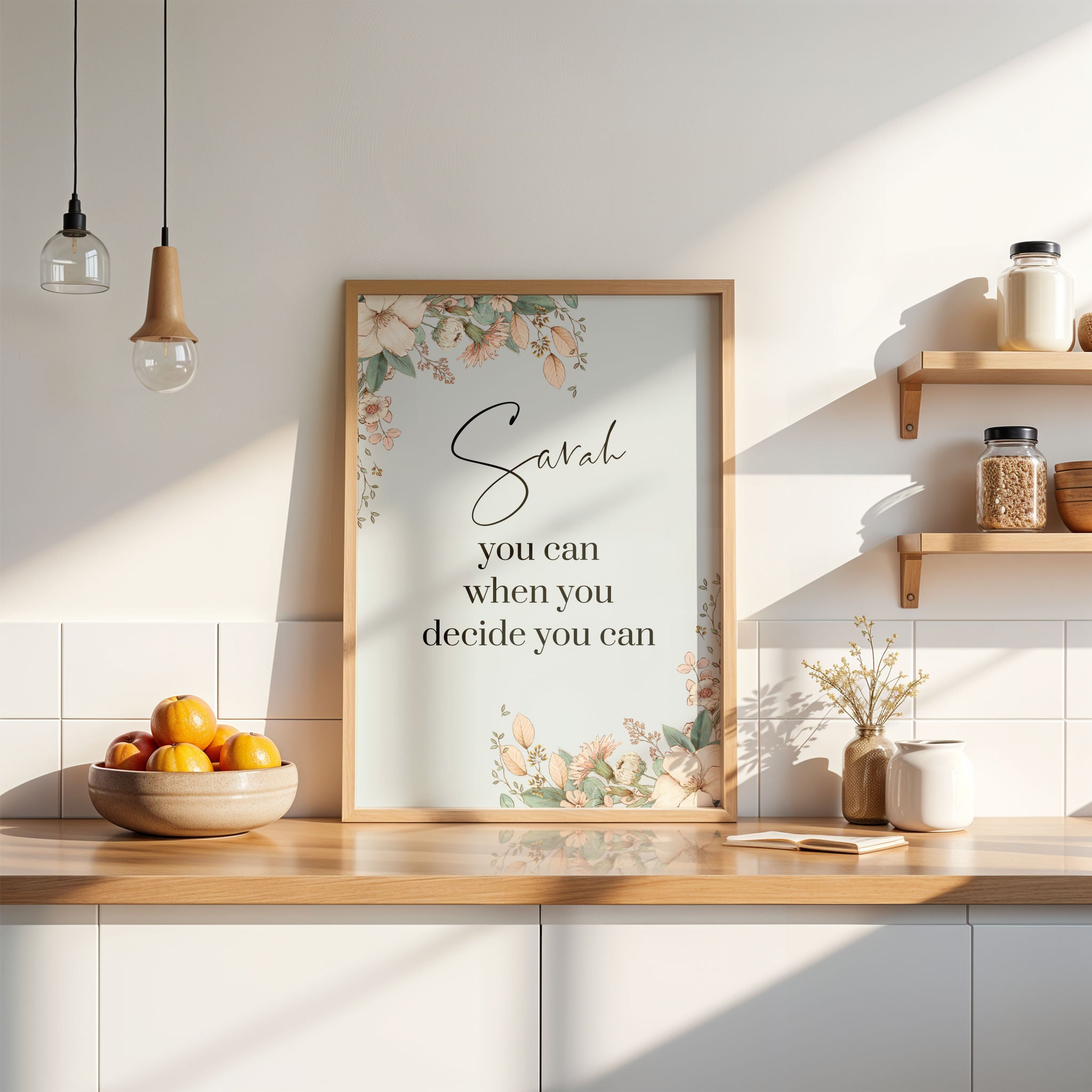 A custom first name wall art print with hand-drawn botanicals, shown in a kitchen setting