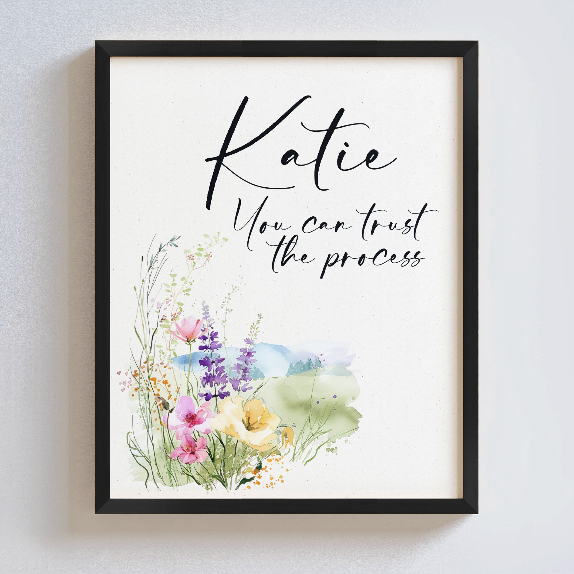 Motivational art with handwriting font and watercolor flowers in a black frame